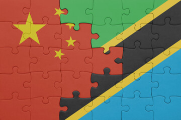 puzzle with the colourful national flag of tanzania and flag of china .