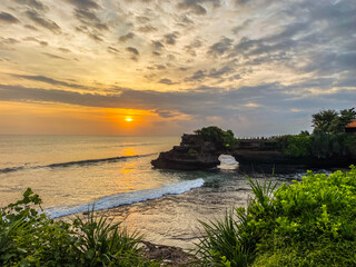 View of Tanah Lot, traditional balinese temple at sunset