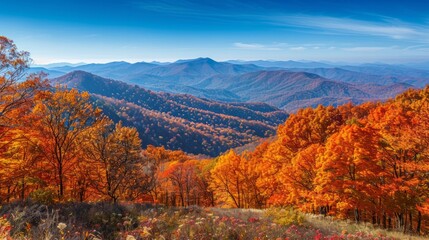 A majestic mountain range in autumn, with colorful foliage, clear blue skies, and a peaceful valley below, showcasing the beauty of nature in the fall season