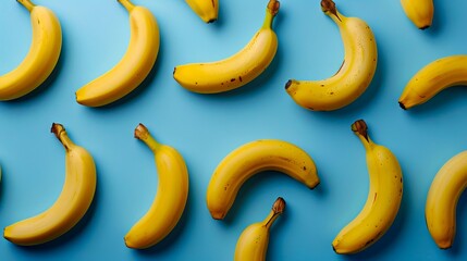 A bunch of bananas on a blue surface.
