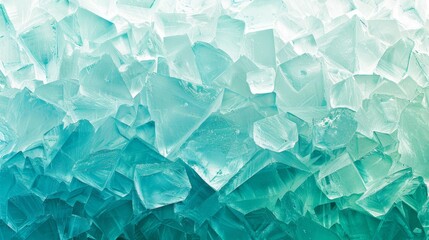  A tight shot of an icy wall, comprised of blue and green ice cubes Water droplets adorn the bottom Bottoms of ice cubes are wetted