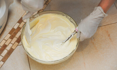 hands delicately layering ingredients to create a luscious tiramisu, showcasing the artistry of homemade desserts