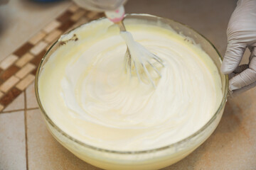 hands delicately layering ingredients to create a luscious tiramisu, showcasing the artistry of homemade desserts