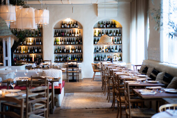 modern restaurant interior with wooden tables and chairs