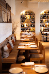 modern restaurant interior with wooden tables and chairs