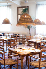 modern restaurant interior with wooden tables and chairs