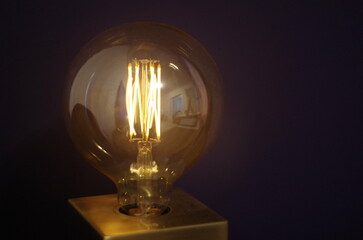  soft warm retro minimalistic light bulb on the wall
