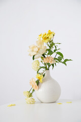 beautiful bouquet in white vase in white interior