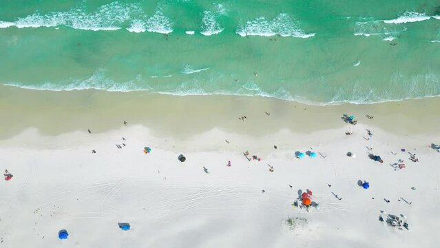 White sand beach with dunes and azure sea of the beach Cabo Frio, Arraial do Cabo, Brazil. Aerial top view.
