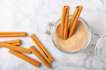 Cinnamon sugar on a texture background. Homemade cinnamon sugar in a bowl on background. Brown sugar. Spice mixture for drinks and baking. Place for text. Copy space.