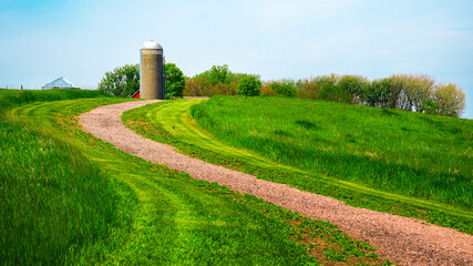 Tranquil farmland summer landscape on the green hill: The beauty of midwestern prairie in Hartford,...