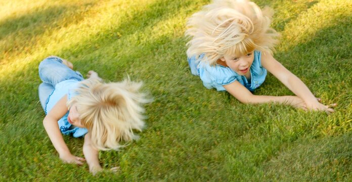 Girls Rolling Down A Hill