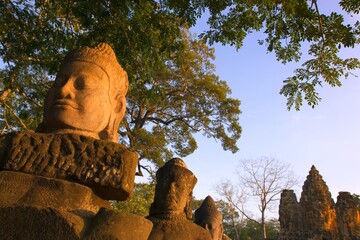 Head Statues And Distant Ruins, Angkor Wat Temple Complex, Angkor Thom, Cambodia
