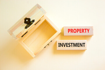 Property investment symbol. Concept words Property investment on beautiful wooden block. Beautiful white paper background. Empty wooden chest. Business Property investment concept. Copy space.