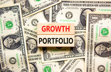 Growth portfolio symbol. Concept words Growth portfolio on beautiful wooden block. Beautiful dollar...