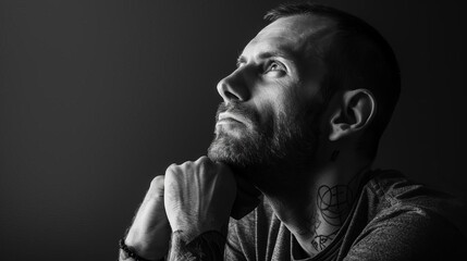 pensive man lost in thought mental health awareness conceptual black and white photo