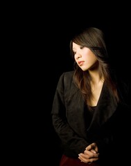 Fototapeta premium Brunette Female Standing With Hands Clasped