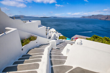 Amazing picturesque landscape, luxury travel vacation. Oia town stairs over sea view  Santorini island, Greece. Traditional famous white houses Caldera. Sunny sky, romance couple vacation summer scene