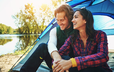 Camping, holiday and couple in tent with love and happiness together on adventure in woods at lake....
