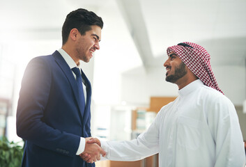Arab, business and people with hand shake in office, recruitment and muslim employee for greeting. B2b partnership, collaboration and congratulation gesture for deal, islam company and onboarding