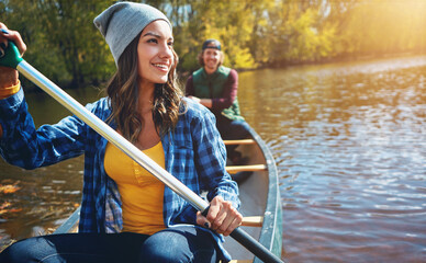 Lake, canoe and couple with nature, summer and hobby with vacation, happiness and getaway trip....