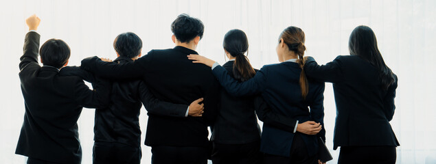 Panoramic banner back view of office worker team standing in line together with friendship posture...