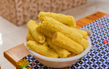 Used and shaved green corn cobs