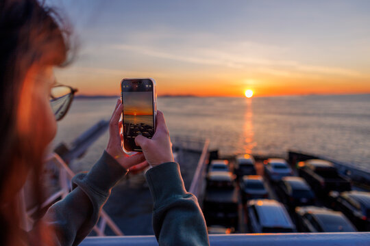 Tourist takes a photo on cell phone