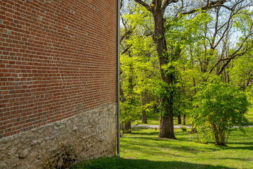 brick wall and park in springtime scenery - historic town of Arrow Rock, Missouri