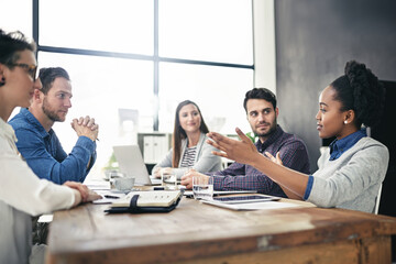 Business people, discussion and meeting in office for teamwork, project and collaboration. Creative agency, diversity and notebook with group for planning, ideas and brainstorming in workplace