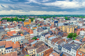 Aerial panoramic view of Kortrijk historical city centre with red tiled roofs of old colorful buildings, skyline horizon of Kortrijk amazing view, Kortrijk old town, West Flanders province, Belgium