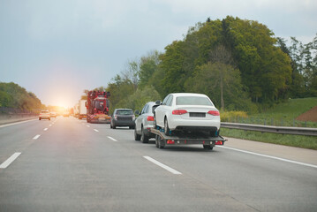 Towing Truck With A Damaged Vehicle After Car Accident Collision.