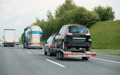 Towing Truck With A Damaged Vehicle After Car Accident Collision.