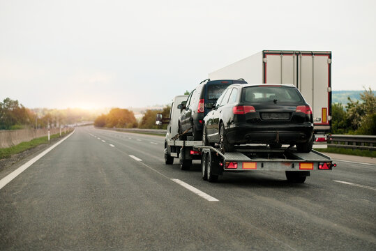 Towing Truck With A Damaged Vehicle After Car Accident Collision.