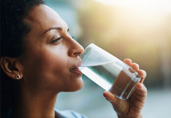 Woman, thinking and home with drinking water in glass for wellness, wellbeing and hydration....