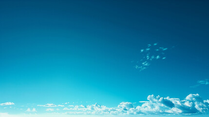 A blue sky with some clouds, blue atmosphere gradients