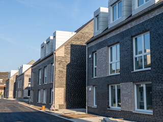 Asphalt street with newly built town houses in Germany