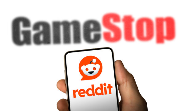 Reddit and Gamestop company logo displayed on smartphone