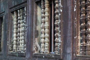 Historic rock carved spindles at Angkor wat temple, Amazing architecture built in 11th century.