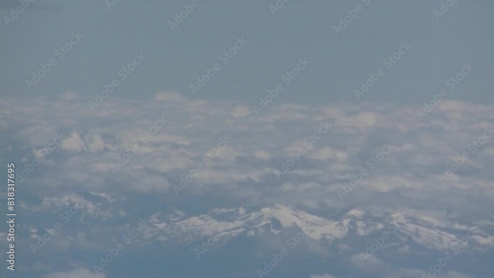 Poster alps mountains visible between clouds and covered with snow - top view of airplane flight. topics: t