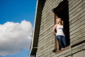 Young Woman In Barn Loft