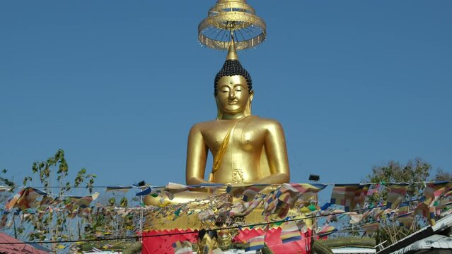 golden buddha statue and flags, Pattaya, Thailand