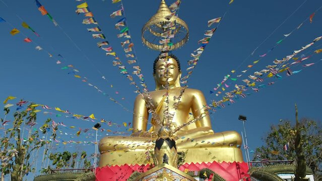 golden buddha statue and flags, Pattaya, Thailand