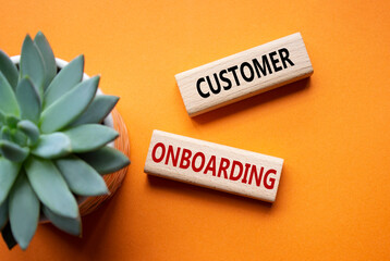 Customer Onboarding symbol. Concept word Customer Onboarding on wooden blocks. Beautiful orange...