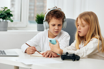 Happy Teenage Siblings Taking a Selfie While Using their Smartphones and Enjoying Online Connection in the Comfort of Their Home