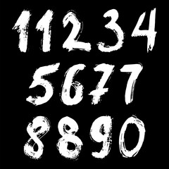 Set of calligraphic numbers painted by white brush on isolated black background. Lettering for your design. Vector illustration.