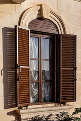 A construction lone ground floor window in Malta