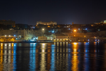 Cospicua, Malta at night as seen from a ship in dry dock