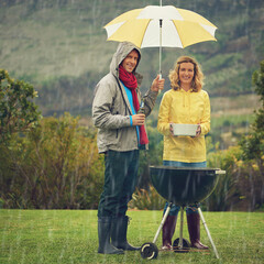Portrait, couple and rain at barbecue in outdoor on vacation or picnic as family in together. Happy...