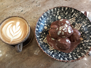 restaurant menu, cafe menu, chocolate profiteroles and latte coffee isolated on wood